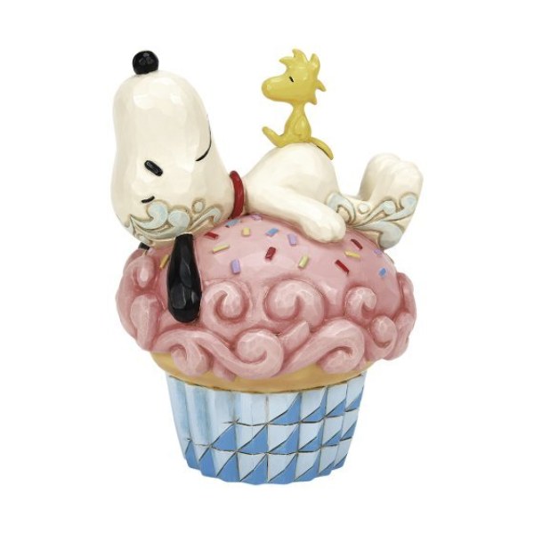 Snoopy sdraiato su un cupcake - Peanuts