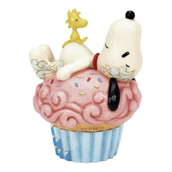 Snoopy sdraiato su un cupcake - Peanuts