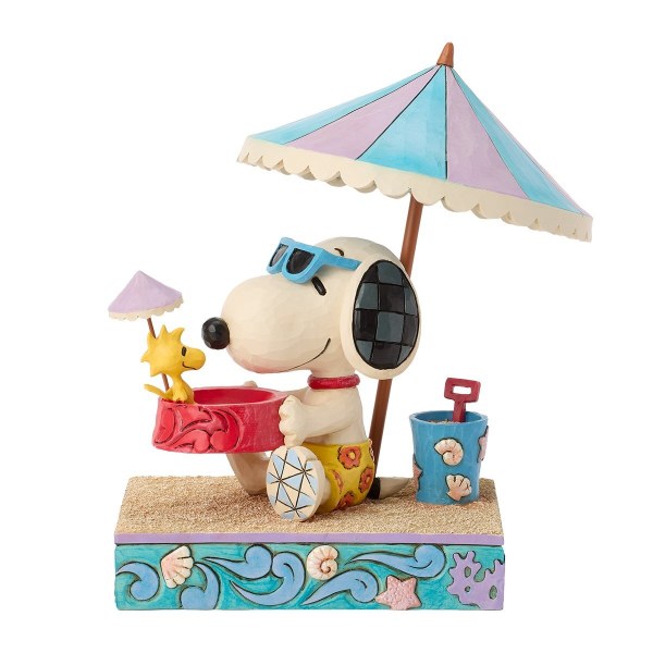 Snoopy che tiene Woodstock in una ciotola in spiaggia - Peanuts